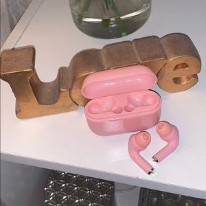 Pink wireless AirPods with Bluetooth